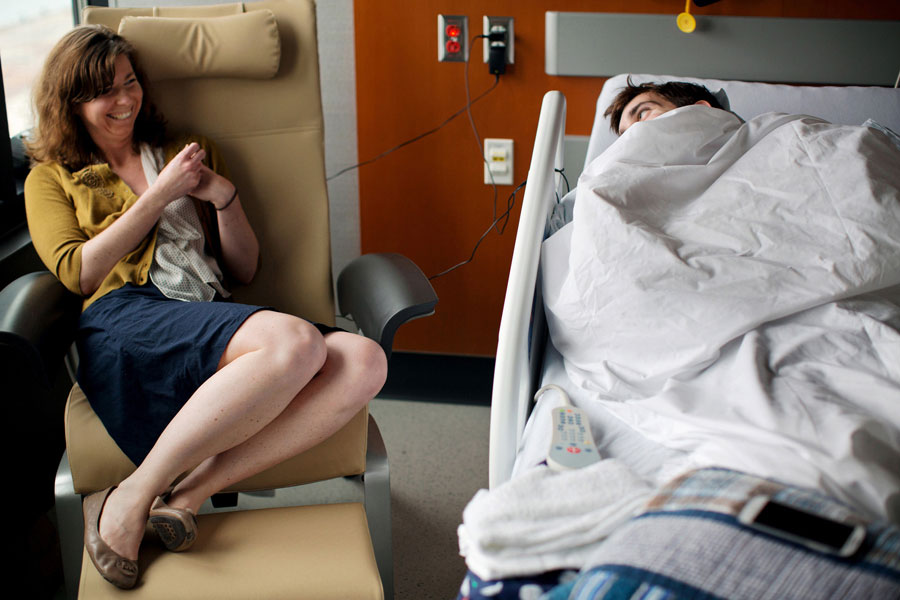 Bauman shares a joke with his girlfriend Erin Hurley at Spaulding Rehabilitation Hospital. He had been at the marathon finish line waiting for her to complete the race when the bombs went off. (Josh Haner, The New York Times - May 8, 2013)