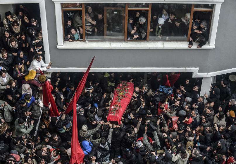 The coffin of Berkin Elvan is carried   on March 11, 2014, in Istanbul. Berkin Elvan, who has been in a coma since June 2013 after being struck in the head by a gas canister during a police crackdown on protesters, died March 11, his family announced via Twitter. The young teenager, the eighth person to be killed in the Gezi Park protests, went into a coma after sustaining a head injury from a gas canister as he went to buy bread during a police crackdown in IstanbulÕs Okmeydanõ neighborhood last June. Elvan has since become one of the prime symbols violence faced by protesters throughout the nationwide Gezi demonstrations. AFP PHOTO/BULENT KILIC        (Photo credit should read BULENT KILIC/AFP/Getty Images)