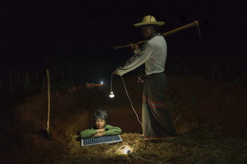 Construction workers dig a household latrine in Pa Dan Kho Village, Kayah State.