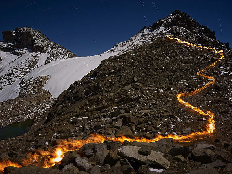 Mapping with a pyrograph, the melting away of the Lewis Glacier on Mt. Kenya.1934 The flame line shows the Lewis Glacier's location in 1934.