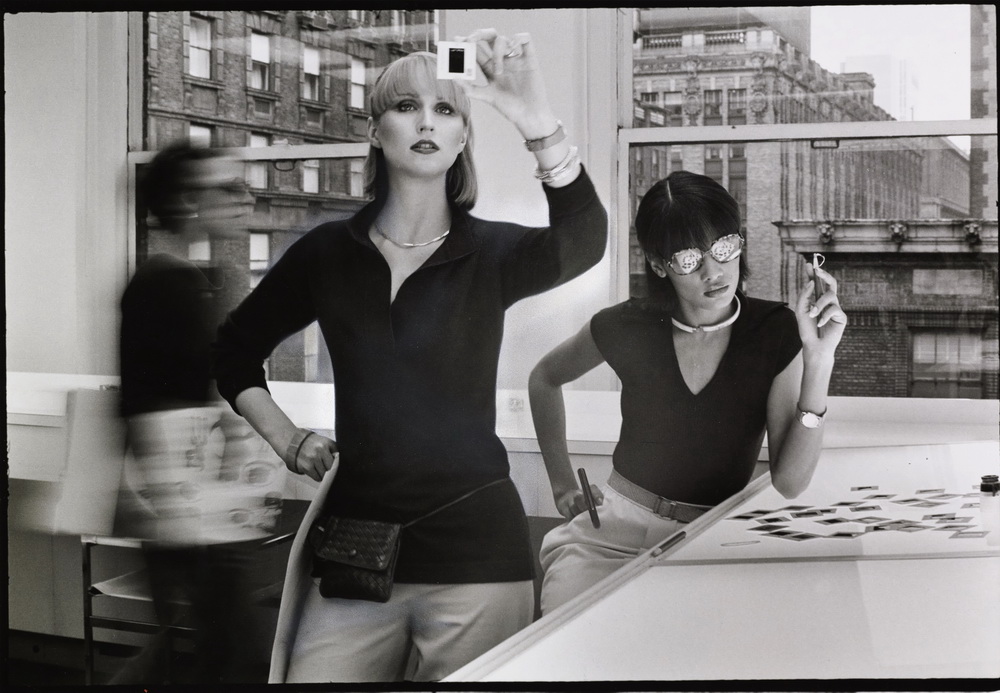 Duane Michals, Two models in an office looking at negatives